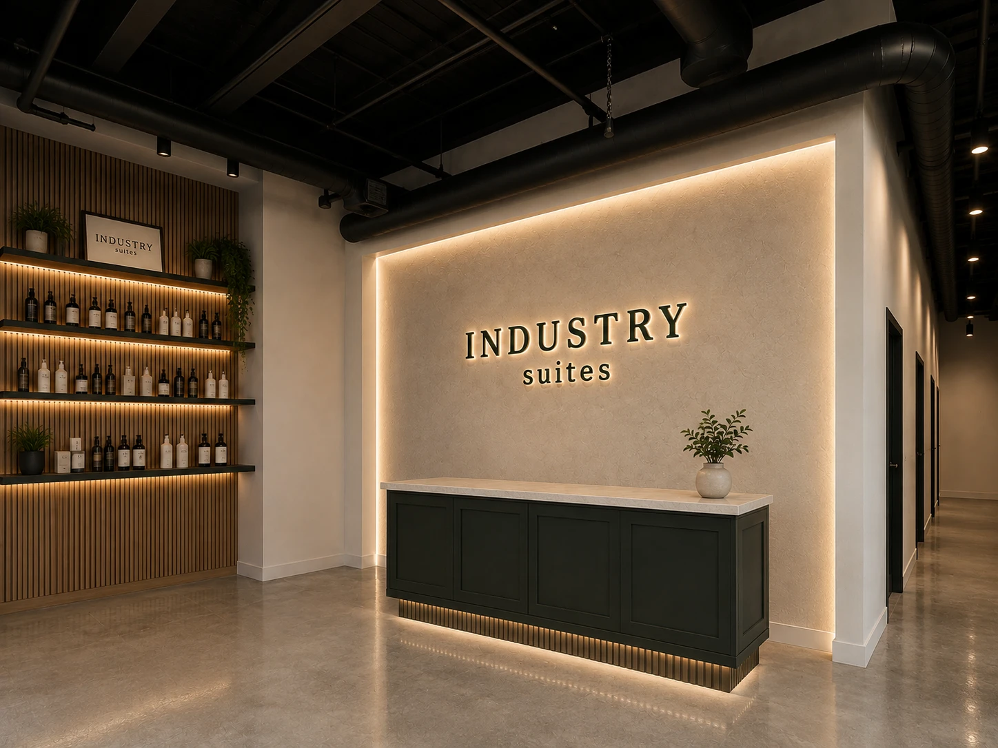 Industry Suites reception with a backlit INDUSTRY suites wordmark, dark green front desk, lit wood-slat retail shelving, and a hallway of private suites