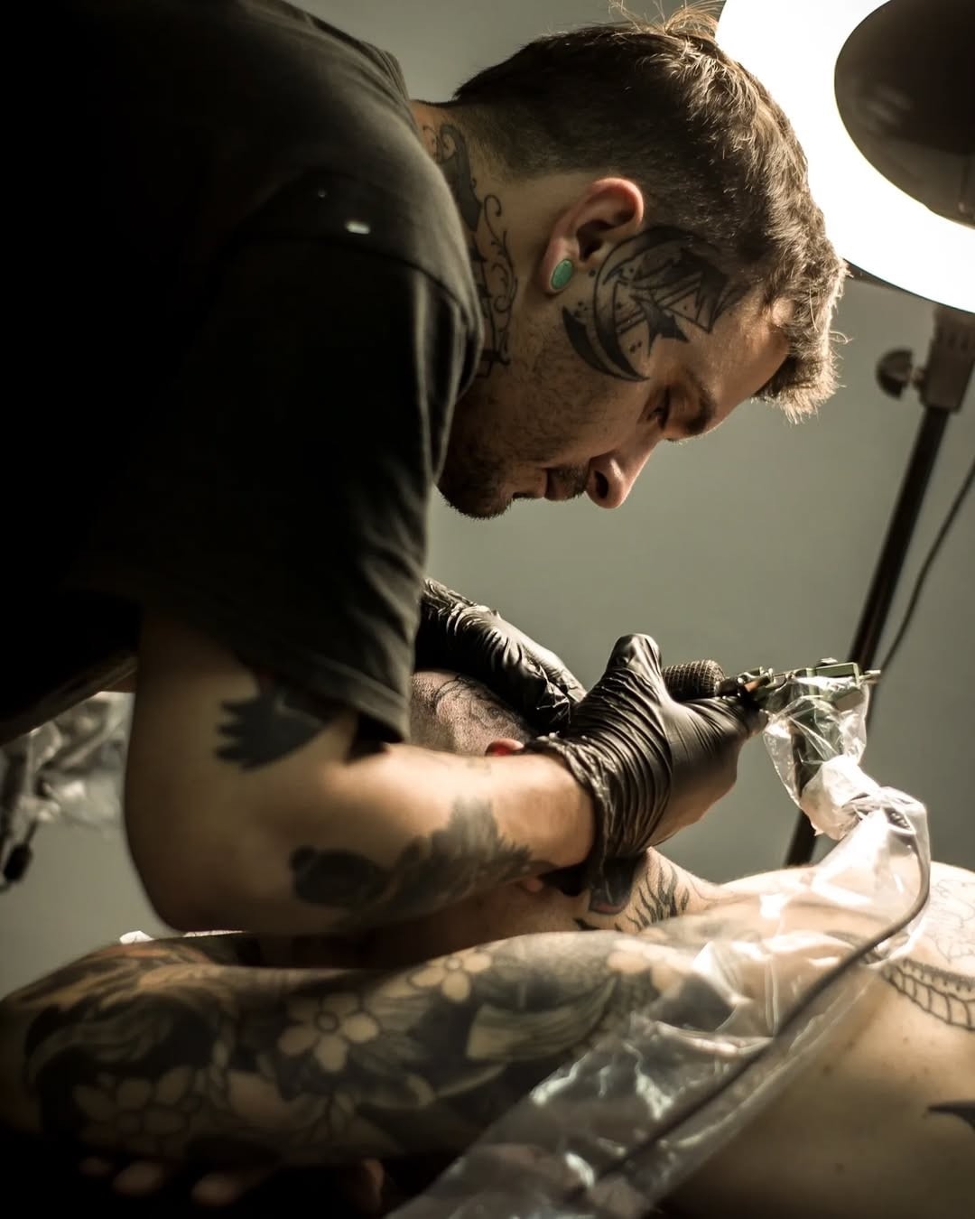 Professional tattoo artist at work